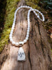 Silver and sea pottery pendant with letters on white pearls