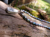 Silver and sea pottery pendant with letters on black pearls