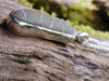 Long Black and white striped beach pebble pendant